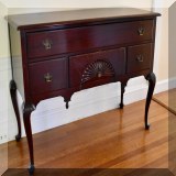 F65. Mahogany lowboy sideboard. Scratching on front. 37”h x 54”w x 21”d - $275 